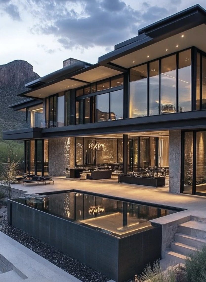 Desert mansion with glass façade and infinity pool