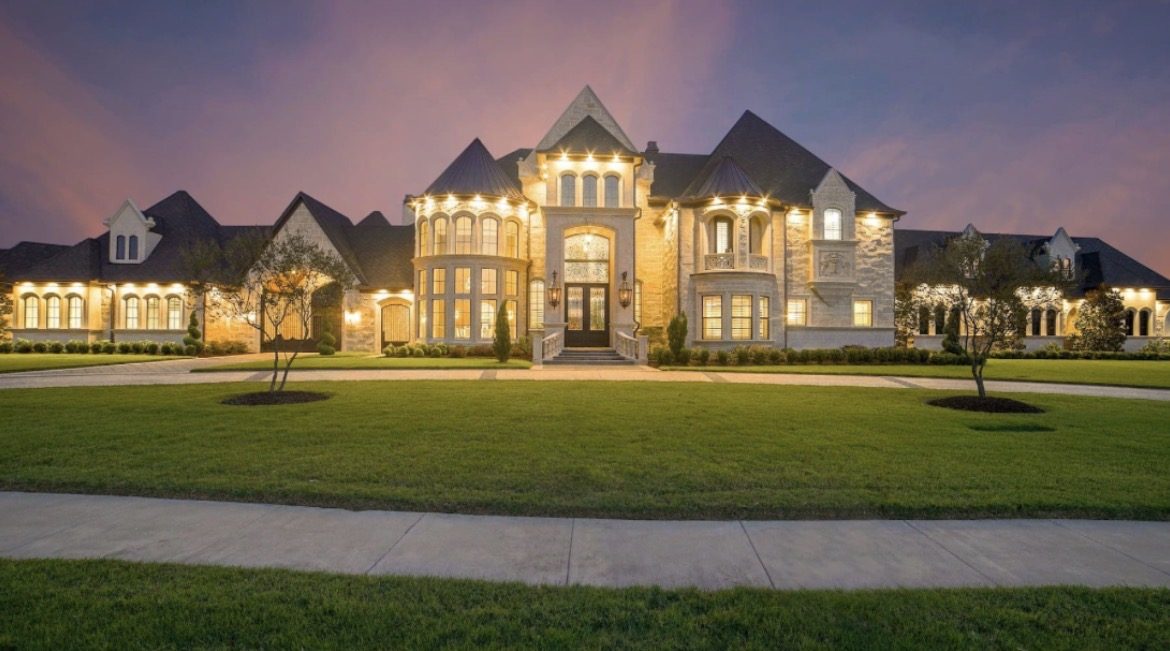 Classic estate mansion illuminated at twilight